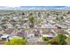 Aerial view showcasing an in-ground pool, patio, and manicured yard in a peaceful neighborhood at 406 W Fellars Dr, Phoenix, AZ 85023