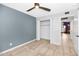 Bedroom featuring a fan and closet with bi-fold doors at 406 W Fellars Dr, Phoenix, AZ 85023