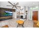 Open-concept living room featuring a fireplace, tile flooring, and a view of the kitchen at 406 W Fellars Dr, Phoenix, AZ 85023