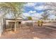 Landscaped backyard features a storage shed and is perfect for outdoor activities and relaxation at 4116 W Milada Dr, Laveen, AZ 85339