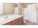 Bright bathroom featuring a long vanity with storage and a shower-tub combo at 4116 W Milada Dr, Laveen, AZ 85339