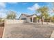 Beige single-story home with a tiled roof, a covered entrance, and a desert landscape at 4116 W Milada Dr, Laveen, AZ 85339