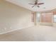 Spacious main bedroom features carpet, neutral walls, a ceiling fan, and many windows at 4116 W Milada Dr, Laveen, AZ 85339