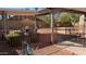 An inviting backyard featuring a covered patio area with outdoor furniture, perfect for relaxing and entertaining at 415 W Mohawk Ln, Phoenix, AZ 85027