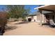 Expansive backyard featuring a covered patio, landscaping, and low-maintenance desert aesthetic at 415 W Mohawk Ln, Phoenix, AZ 85027