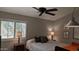 Bright bedroom featuring two large windows, neutral color scheme, and a ceiling fan at 415 W Mohawk Ln, Phoenix, AZ 85027