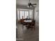 Cozy dining area featuring neutral paint colors, a ceiling fan, and lots of natural light at 415 W Mohawk Ln, Phoenix, AZ 85027