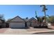 Inviting single-story home featuring a two-car garage and xeriscaped front yard with desert landscaping at 415 W Mohawk Ln, Phoenix, AZ 85027