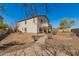 View of the home's exterior and backyard featuring a winding walkway, xeriscaping, and a covered patio at 599 W Agrarian Hills Dr, San Tan Valley, AZ 85143