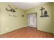 A bright bedroom showcasing laminate floors, a closet, and unique wall art decals at 599 W Agrarian Hills Dr, San Tan Valley, AZ 85143