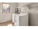 Functional laundry room equipped with modern appliances and ample storage space at 599 W Agrarian Hills Dr, San Tan Valley, AZ 85143