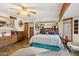 Bright bedroom featuring a ceiling fan, a dresser, and ample storage space at 6217 W Orange Dr, Glendale, AZ 85301