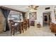 Inviting dining room with tile flooring, decorative art, and natural lighting at 6217 W Orange Dr, Glendale, AZ 85301