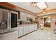 Spacious kitchen features stainless steel appliances, lots of counter space, and tile flooring at 6217 W Orange Dr, Glendale, AZ 85301