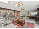 Cozy living room with skylights, tile floors, fireplace, and comfortable seating at 6217 W Orange Dr, Glendale, AZ 85301