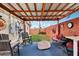 Covered patio with seating area, perfect for outdoor relaxation and enjoying the backyard view at 6217 W Orange Dr, Glendale, AZ 85301