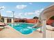 Relaxing pool with a slide, patio, and BBQ, perfect for outdoor entertaining and enjoying sunny days at 6217 W Orange Dr, Glendale, AZ 85301