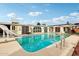 Sparkling pool featuring a slide and lounging area, perfect for cooling off and outdoor fun at 6217 W Orange Dr, Glendale, AZ 85301