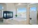 Bright bathroom featuring a modern soaking tub and a separate shower at 7418 E Sandia Cir, Mesa, AZ 85207