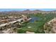 Scenic aerial view of the golf course with lush green fairways and desert landscape, perfect for leisure and recreation at 7418 E Sandia Cir, Mesa, AZ 85207