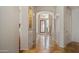 Hallway with travertine floors and archways leading to other rooms in the home at 7418 E Sandia Cir, Mesa, AZ 85207