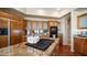 Close up of kitchen island with gas cooktop, and wood cabinets at 7418 E Sandia Cir, Mesa, AZ 85207