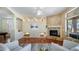 Inviting living room with stone fireplace, hardwood floors, and recessed lighting at 7418 E Sandia Cir, Mesa, AZ 85207