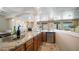 Wet bar with granite countertop and view of the living room at 7418 E Sandia Cir, Mesa, AZ 85207