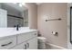 Updated bathroom featuring modern vanity with marble countertop and sleek black hardware at 830 N Cholla St, Chandler, AZ 85224