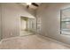 Bedroom with carpet and mirror doors has a view of the pool from its window at 830 N Cholla St, Chandler, AZ 85224