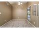 Dining space with neutral paint, carpeted floors, natural light from a window, and classic chandelier at 830 N Cholla St, Chandler, AZ 85224