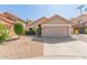 Charming home featuring a terra cotta tile roof, desert landscaping, and an attached two-car garage in a sunny neighborhood at 830 N Cholla St, Chandler, AZ 85224