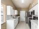 Well-lit kitchen featuring white cabinets, stylish countertops, stainless steel appliances, and modern fixtures at 830 N Cholla St, Chandler, AZ 85224