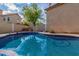 Backyard pool featuring beautiful blue water and a well-manicured yard for relaxation at 830 N Cholla St, Chandler, AZ 85224