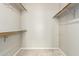 Walk-in closet with carpet and built-in shelving, ready for organization and storage at 830 N Cholla St, Chandler, AZ 85224