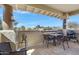 Charming balcony featuring a table and grill, perfect for outdoor relaxation and entertaining at 9100 E Raintree Dr # 209, Scottsdale, AZ 85260