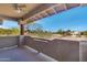 Outdoor balcony offers a scenic view of the trees, grounds, and community buildings at 9100 E Raintree Dr # 209, Scottsdale, AZ 85260