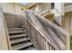 Outdoor staircase with metal handrail leading to upstairs units at 9100 E Raintree Dr # 209, Scottsdale, AZ 85260