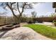 Backyard featuring lush landscaping, a fire pit, and a relaxing water feature at 9435 E Mohawk Ln, Scottsdale, AZ 85255