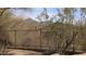 A desert backyard scene with a mountain view beyond the fence, blending nature and home at 9435 E Mohawk Ln, Scottsdale, AZ 85255