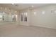 Bright bedroom with neutral carpet, plantation shutters, and a spacious closet at 9435 E Mohawk Ln, Scottsdale, AZ 85255