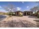 Beautiful single-Gathering home with desert landscaping, a two-car garage, and a charming entrance at 9435 E Mohawk Ln, Scottsdale, AZ 85255