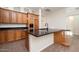 Modern kitchen with stainless steel appliances, a large island, and custom cabinetry at 9435 E Mohawk Ln, Scottsdale, AZ 85255