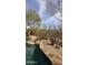 Backyard featuring a pool and desert landscape, ideal for relaxing outdoor living at 9435 E Mohawk Ln, Scottsdale, AZ 85255