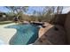 Outdoor pool with rock features and desert landscaping at 9435 E Mohawk Ln, Scottsdale, AZ 85255