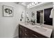 Bathroom with double sink vanity, modern fixtures and stylish décor at 9675 E Cinnabar Ave, Scottsdale, AZ 85258