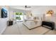 Bright and stylish main bedroom with a ceiling fan and access to a private patio at 9675 E Cinnabar Ave, Scottsdale, AZ 85258