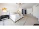 Spacious bedroom featuring a ceiling fan, large bed and an ensuite bathroom at 9675 E Cinnabar Ave, Scottsdale, AZ 85258