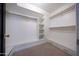 Well-organized walk-in closet with shelving and drawers for optimal storage at 9675 E Cinnabar Ave, Scottsdale, AZ 85258