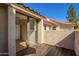 Private balcony with a wood deck and sliding glass doors, enhancing indoor-outdoor flow at 9705 E Mountain View Rd # 1056, Scottsdale, AZ 85258